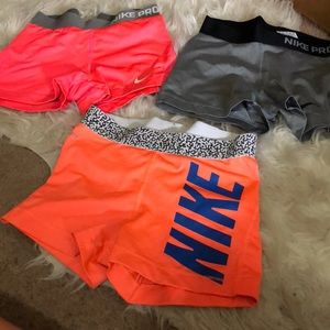 Orange with blue Nike logo, Nike Pros